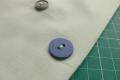 How to sew a button on a jacket